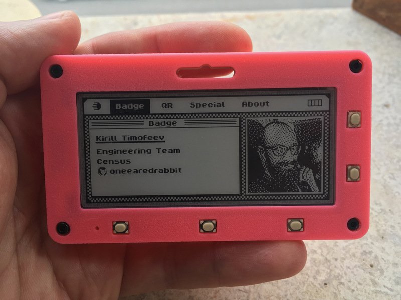 A programmable E Ink badge containing four screens makes it really cool